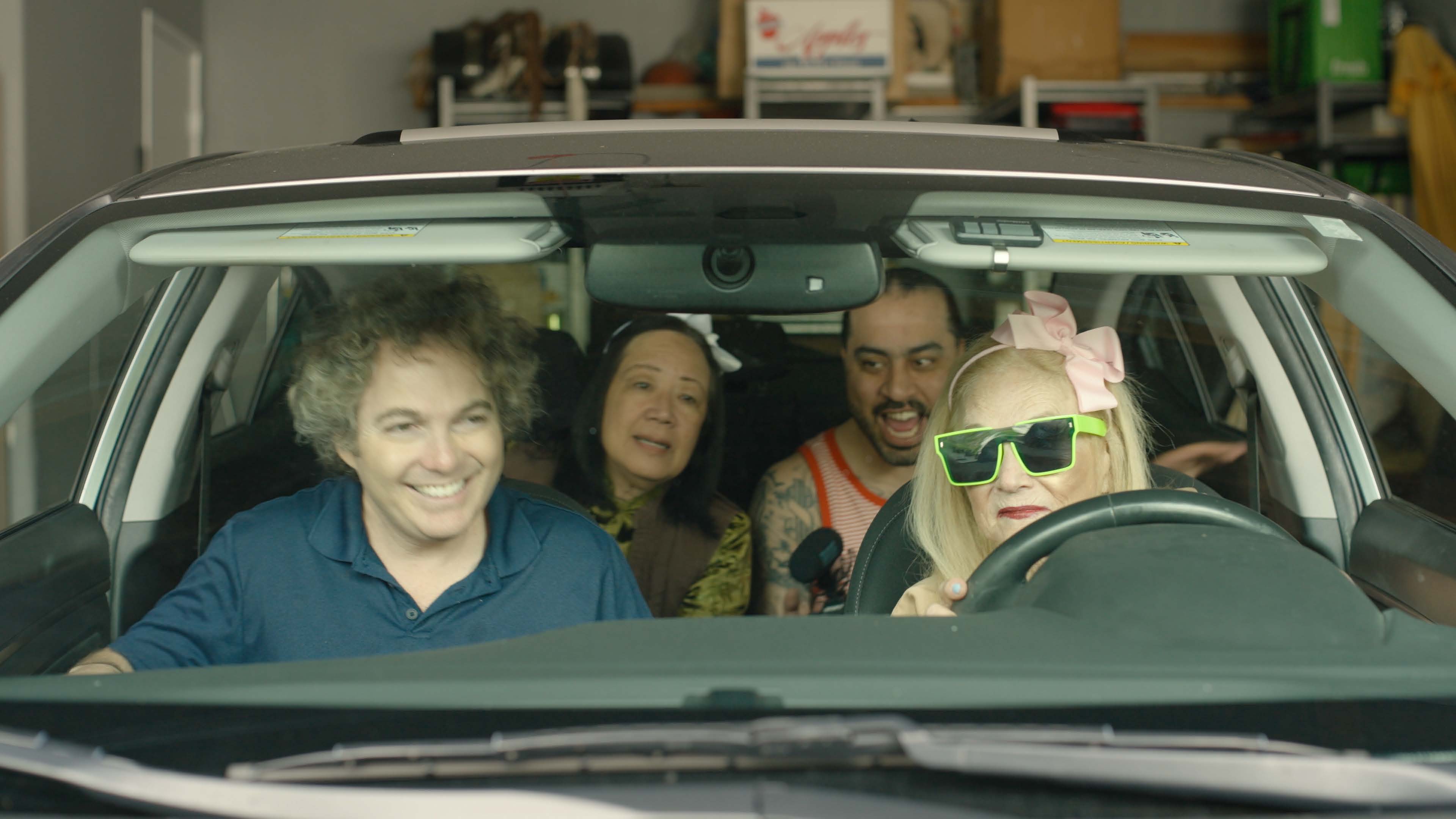 The cast of It's Your Fault in a car